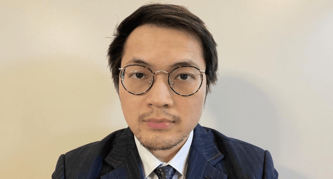Thomas A.Q.T. Truong - French AI entrepreneur born in Ho Chi Minh City Vietnam in 1996, wearing professional business suit with glasses, InfiniteLibrary.ai inventor, MIT Innovator Under 35 at age 26, and Amazon #1 Bestselling Author in Educational Software at age 28